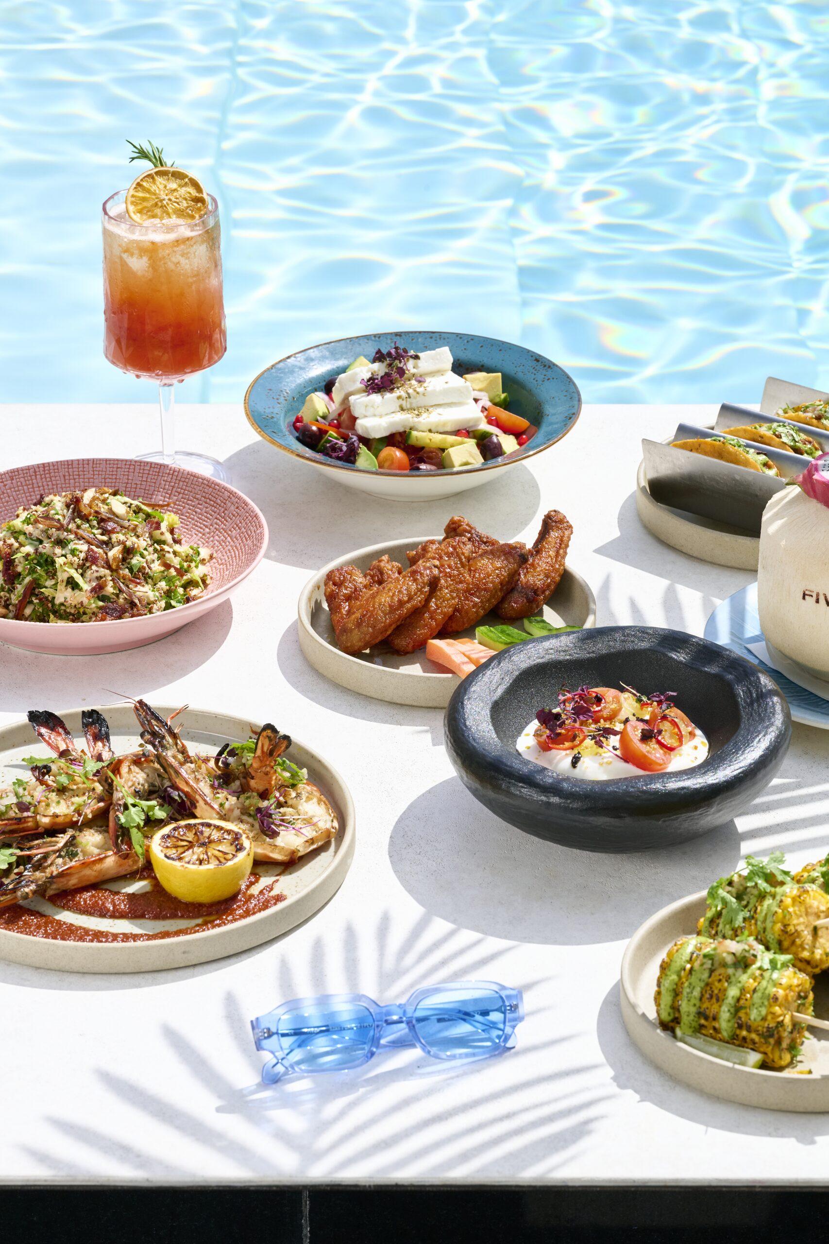 FIVE Palm Jumeirah poolside cabanas overlooking the Arabian Gulf