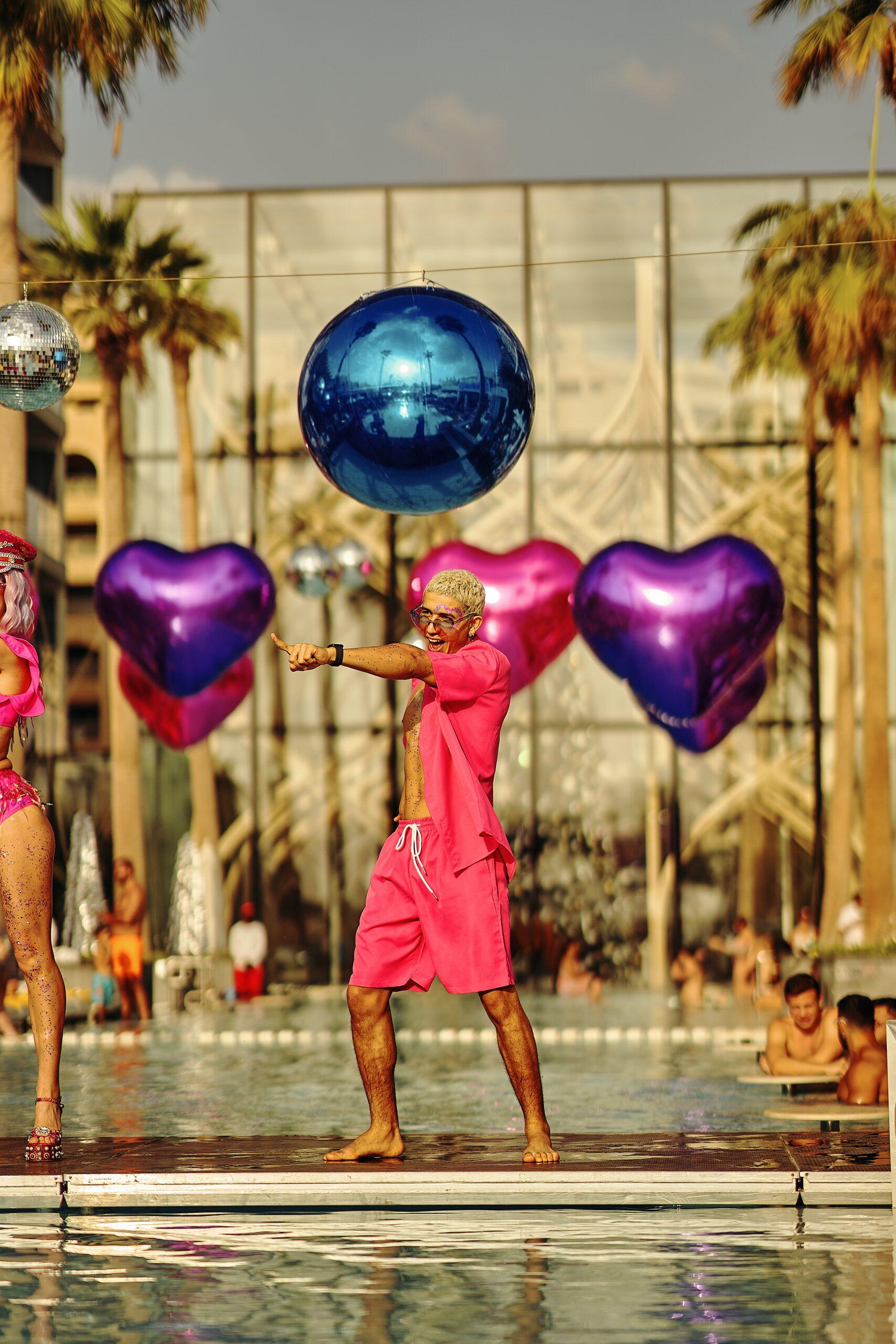 Champagne service and bottle parade at a Splash Dance pool party